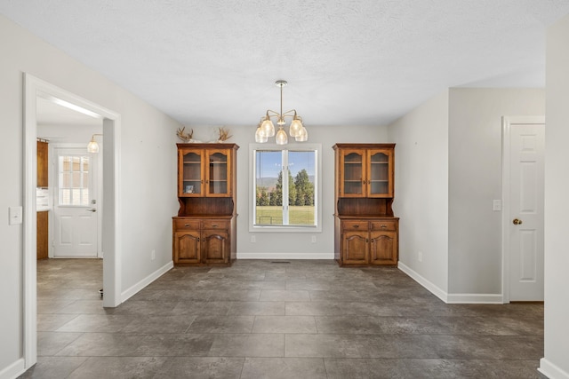 10304 Spotswood Trl, Mcgaheysville, VA 22840 - dining room featuring a chandelier, baseboards, and a textured ceiling