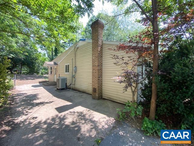 1430 Shenandoah Ave, Waynesboro, VA 22980 - view of side of property with a chimney and a patio
