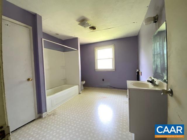1430 Shenandoah Ave, Waynesboro, VA 22980 - bathroom featuring vanity, tile patterned floors, and shower / washtub combination