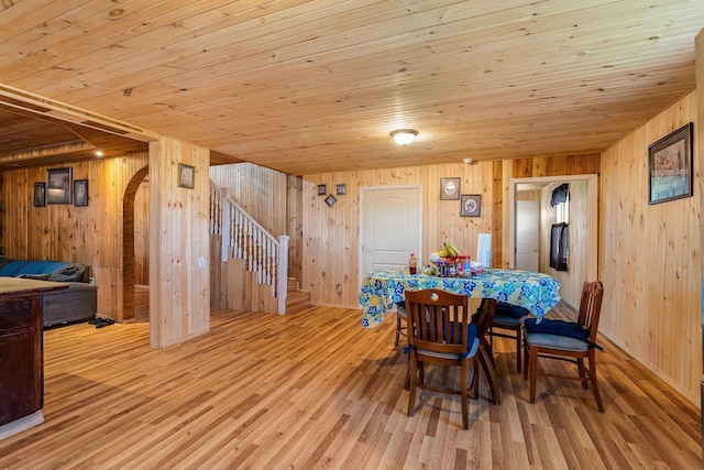 2015 Cecil Wampler Rd, Rockingham, VA 22841 - dining room with wooden walls, wood finished floors, stairway, wood ceiling, and arched walkways