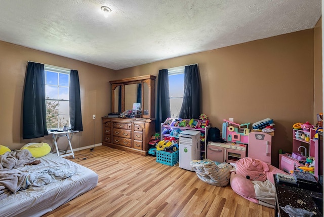 2015 Cecil Wampler Rd, Rockingham, VA 22841 - bedroom with wood finished floors, a textured ceiling, and baseboards