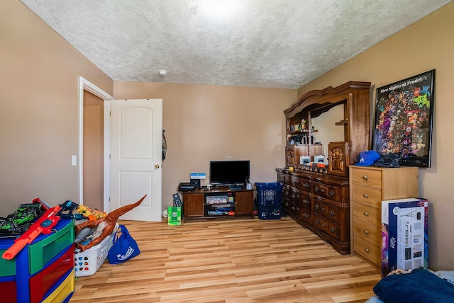 2015 Cecil Wampler Rd, Rockingham, VA 22841 - bedroom featuring wood finished floors and a textured ceiling