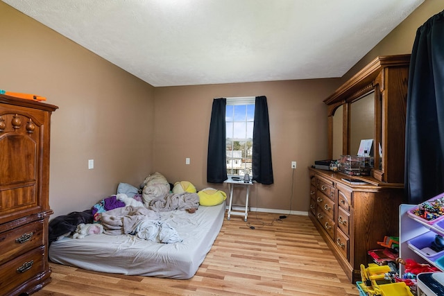 2015 Cecil Wampler Rd, Rockingham, VA 22841 - bedroom with light wood finished floors and baseboards