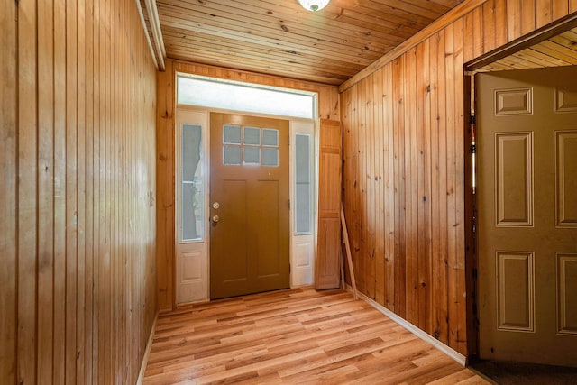 2015 Cecil Wampler Rd, Rockingham, VA 22841 - entryway with wood ceiling, wooden walls, and light wood-type flooring