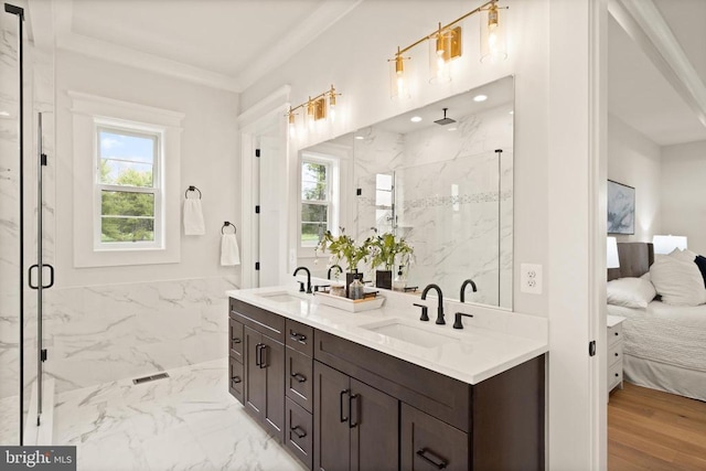  - full bathroom featuring a marble finish shower, ensuite bathroom, double vanity, marble finish flooring, and crown molding