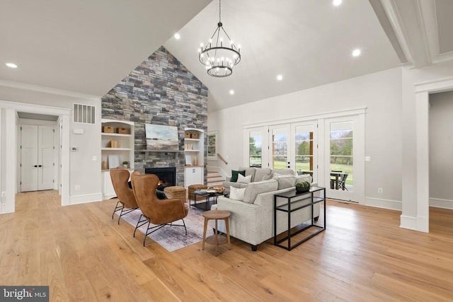  - living room with light wood-style flooring, a fireplace, baseboards, high vaulted ceiling, and recessed lighting