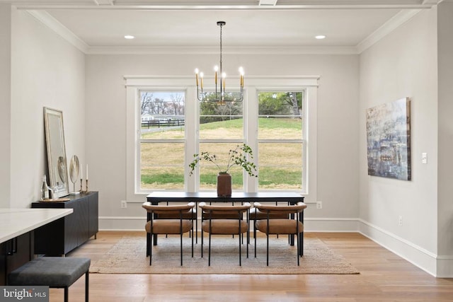  - dining room featuring healthy amount of natural light, light wood finished floors, baseboards, ornamental molding, and recessed lighting