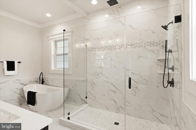  - bathroom featuring a marble finish shower, plenty of natural light, a freestanding bath, recessed lighting, and crown molding