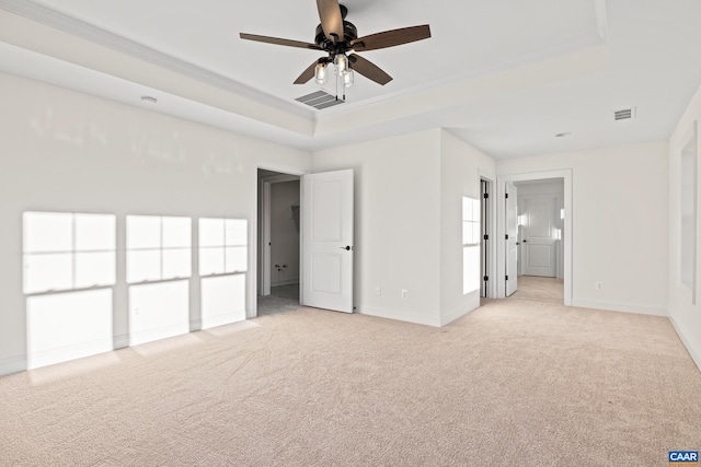 121 Yates Cir, Stanardsville, VA 22973 - unfurnished bedroom with baseboards, light carpet, a tray ceiling, and visible vents