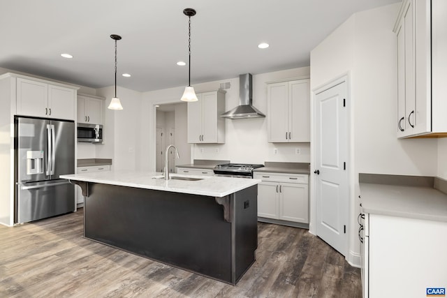 121 Yates Cir, Stanardsville, VA 22973 - kitchen featuring a sink, stainless steel appliances, a kitchen breakfast bar, dark wood-type flooring, and wall chimney range hood