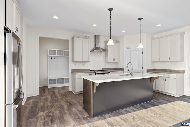 121 Yates Cir, Stanardsville, VA 22973 - kitchen featuring a sink, a kitchen island with sink, wall chimney exhaust hood, dark wood-style floors, and appliances with stainless steel finishes