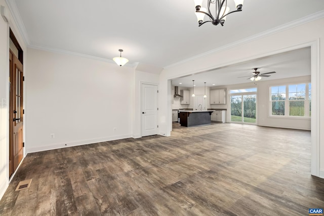 121 Yates Cir, Stanardsville, VA 22973 - unfurnished living room featuring baseboards, ornamental molding, dark wood finished floors, and visible vents