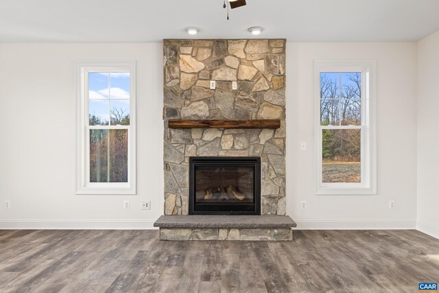 121 Yates Cir, Stanardsville, VA 22973 - interior details featuring baseboards, a stone fireplace, ceiling fan, and wood finished floors
