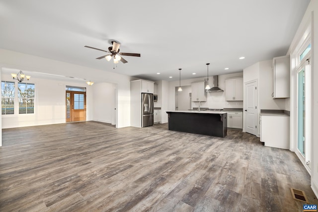 121 Yates Cir, Stanardsville, VA 22973 - kitchen with open floor plan, stainless steel refrigerator with ice dispenser, visible vents, wall chimney range hood, and dark wood-style floors
