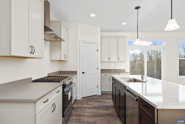 121 Yates Cir, Stanardsville, VA 22973 - kitchen featuring hanging light fixtures, a sink, wall chimney exhaust hood, dark wood-type flooring, and appliances with stainless steel finishes