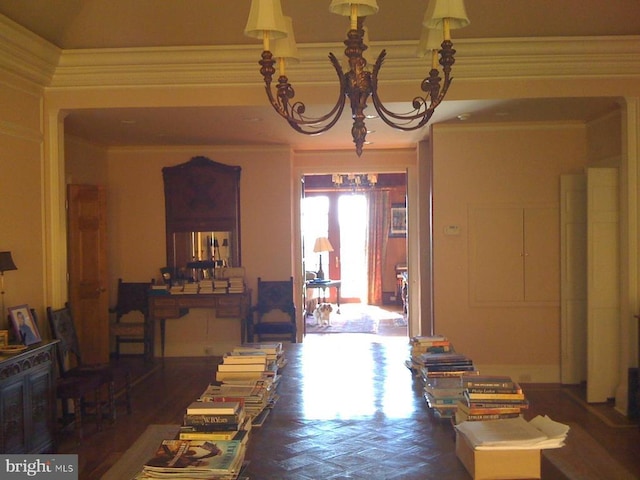 - dining room featuring a chandelier and crown molding