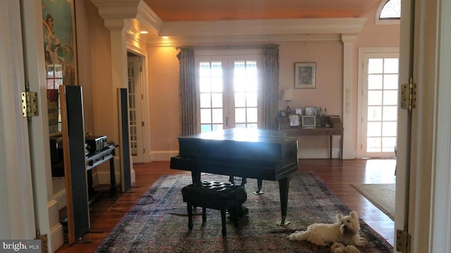  - sitting room with ornamental molding, wood finished floors, french doors, and baseboards