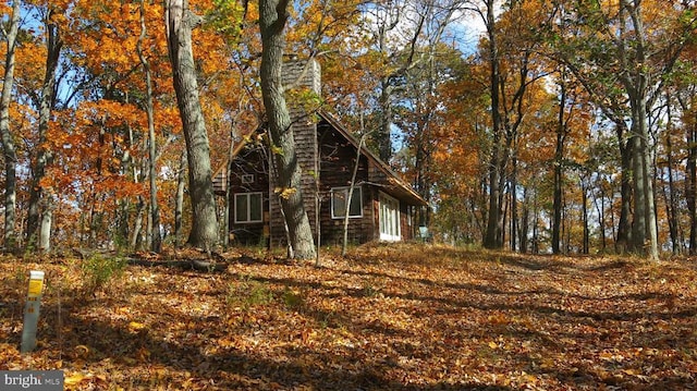  - view of property exterior with a chimney