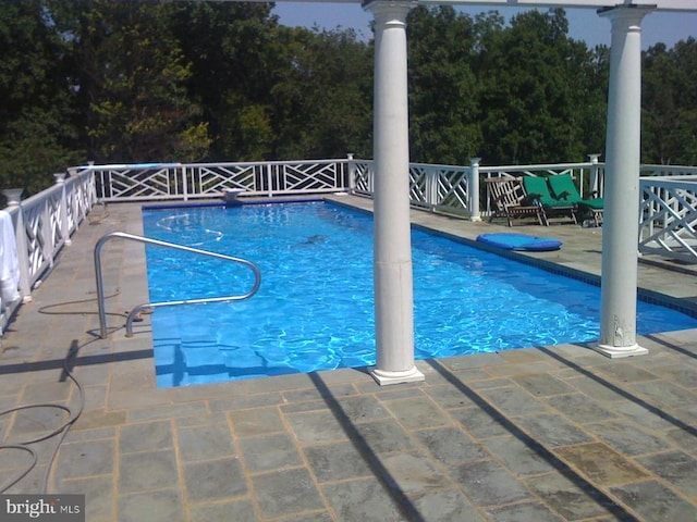  - view of swimming pool featuring a patio