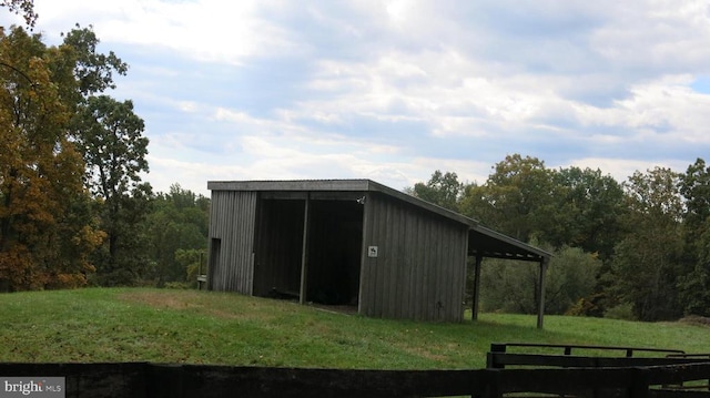  - view of pole building featuring a yard