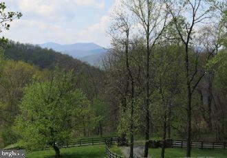  - mountain view featuring a forest