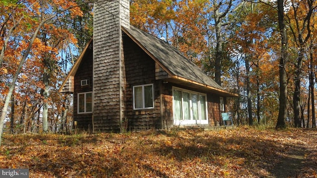  - view of home's exterior with a chimney