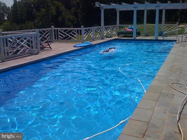  - outdoor pool with a pergola