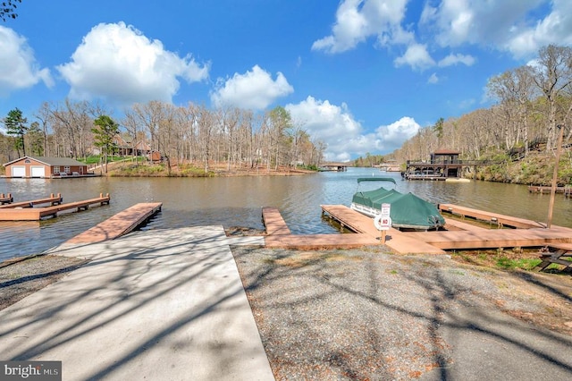 dock area with a water view and a boat ramp