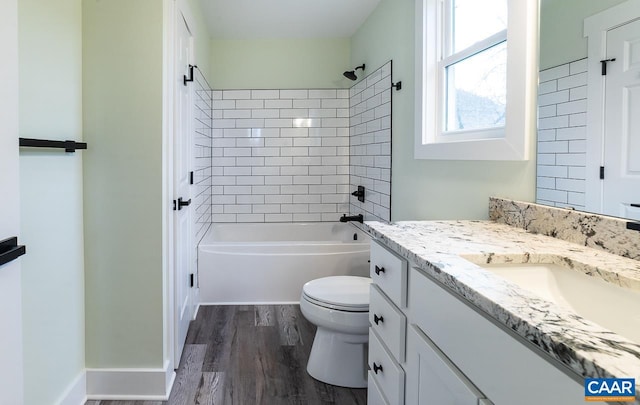 bathroom with toilet, shower / bathtub combination, vanity, and wood finished floors