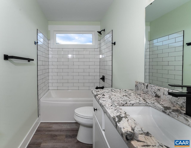full bathroom with toilet, vanity, shower / washtub combination, and wood finished floors