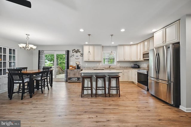 1003 Confederate Dr, Locust Grove, VA 22508 - kitchen with stainless steel appliances, healthy amount of natural light, a chandelier, light wood-style floors, and recessed lighting