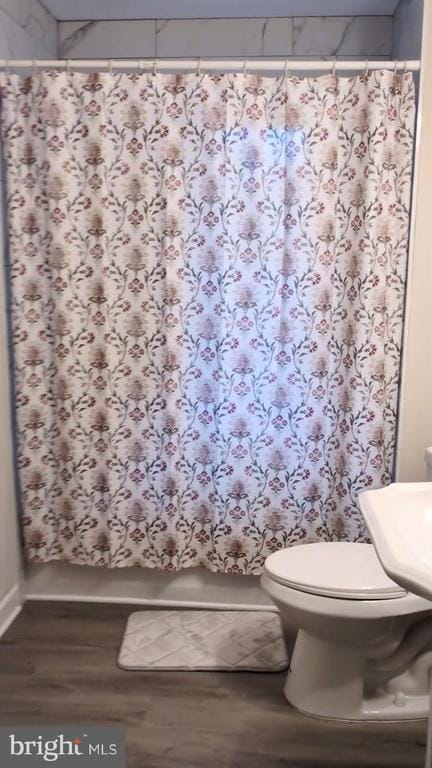 6461 Brokenburg Rd, Spotsylvania, VA 22551 - bathroom with wood finished floors, toilet, and curtained shower