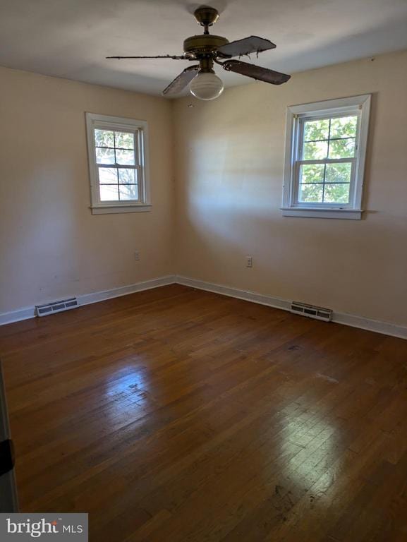 6461 Brokenburg Rd, Spotsylvania, VA 22551 - spare room with healthy amount of natural light, baseboards, and hardwood / wood-style floors
