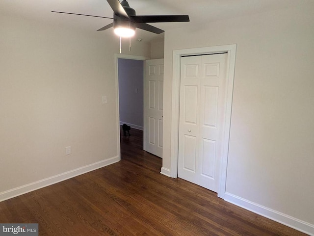 6461 Brokenburg Rd, Spotsylvania, VA 22551 - unfurnished bedroom with dark wood-type flooring, baseboards, a closet, and a ceiling fan