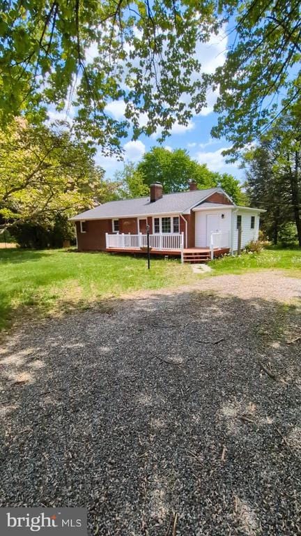 6461 Brokenburg Rd, Spotsylvania, VA 22551 - ranch-style house with a wooden deck and a chimney
