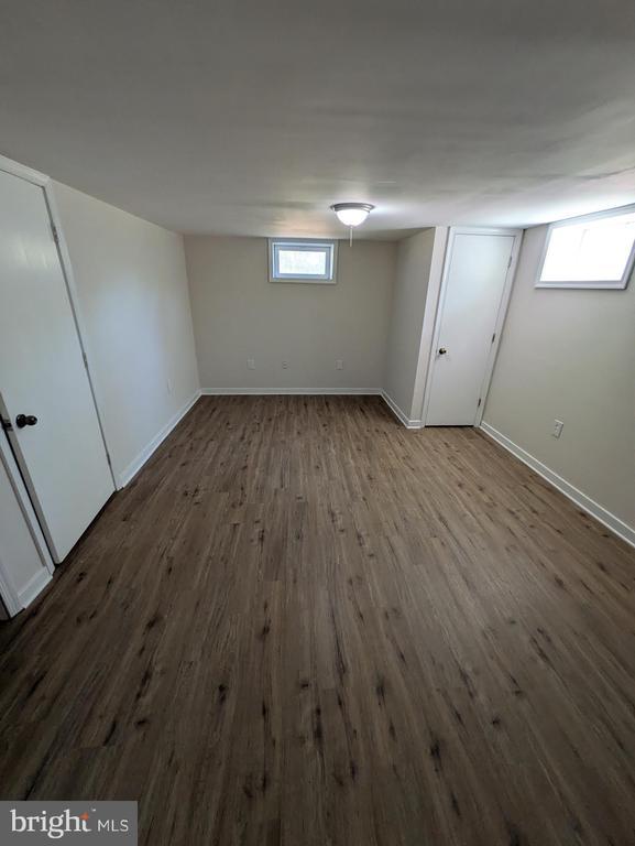 6461 Brokenburg Rd, Spotsylvania, VA 22551 - basement with dark wood-type flooring and baseboards