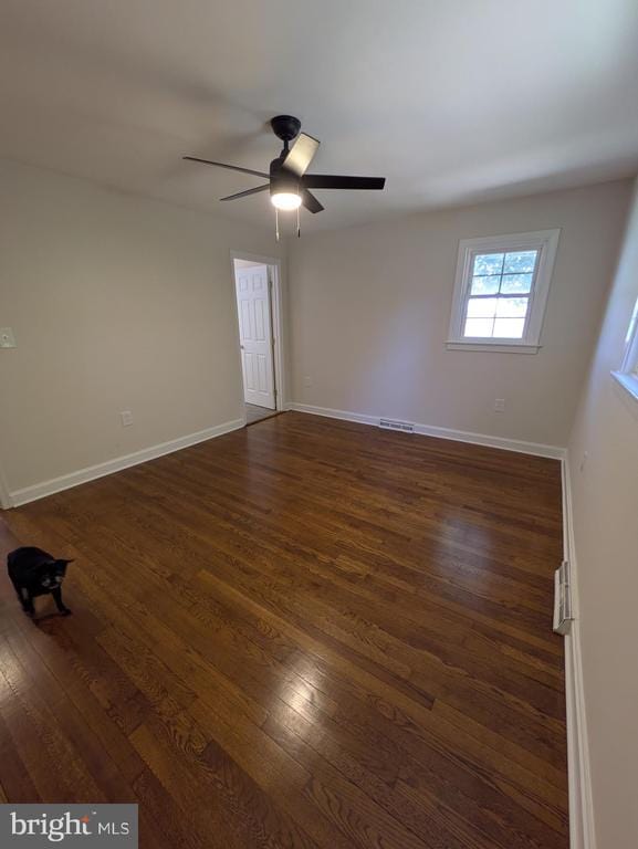 6461 Brokenburg Rd, Spotsylvania, VA 22551 - spare room with dark wood-type flooring, a ceiling fan, and baseboards