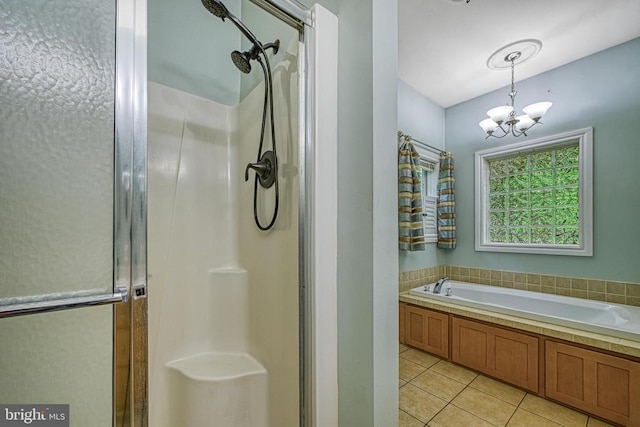 188 Byrd Point Ln, Louisa, VA 23093 - full bath featuring a stall shower, tile patterned floors, a chandelier, and a garden tub