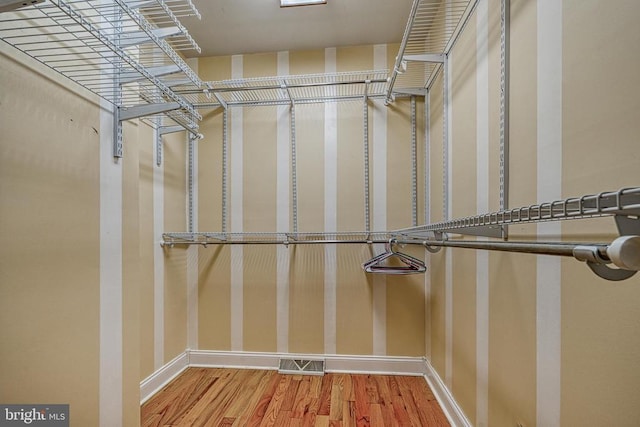 188 Byrd Point Ln, Louisa, VA 23093 - walk in closet featuring wood finished floors