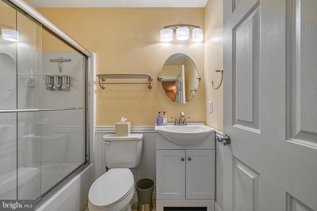 188 Byrd Point Ln, Louisa, VA 23093 - full bath with vanity, a wainscoted wall, and shower / bath combination with glass door