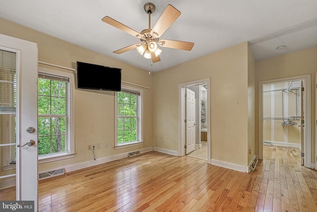 188 Byrd Point Ln, Louisa, VA 23093 - unfurnished bedroom featuring light wood-type flooring, a ceiling fan, and ensuite bath