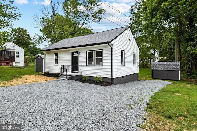 105 Cammack St, Louisa, VA 23093 - view of front of house featuring a storage shed, an outdoor structure, crawl space, and a front yard