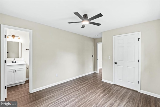 105 Cammack St, Louisa, VA 23093 - unfurnished bedroom featuring a sink, wood finished floors, and baseboards
