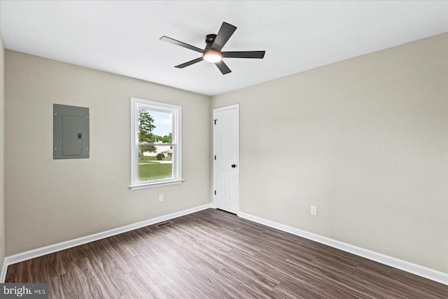 105 Cammack St, Louisa, VA 23093 - spare room with electric panel, dark wood-type flooring, baseboards, and ceiling fan