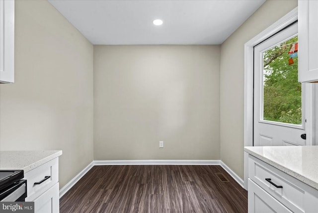 105 Cammack St, Louisa, VA 23093 - unfurnished dining area featuring baseboards, dark wood-style flooring, and recessed lighting