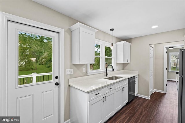 105 Cammack St, Louisa, VA 23093 - kitchen featuring a sink, appliances with stainless steel finishes, baseboards, white cabinetry, and light countertops