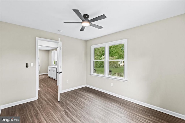 105 Cammack St, Louisa, VA 23093 - unfurnished bedroom with dark wood-style flooring, baseboards, and a ceiling fan