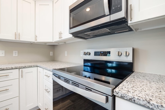 16854 E Summit Ave E, Elkton, VA 22827 - kitchen with stainless steel appliances, white cabinets, wood finished floors, and light stone counters