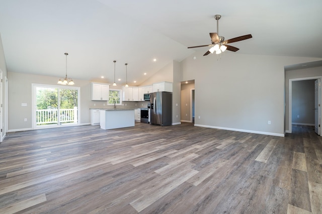 16854 E Summit Ave E, Elkton, VA 22827 - unfurnished living room featuring a chandelier, a ceiling fan, high vaulted ceiling, a sink, and dark wood-style flooring
