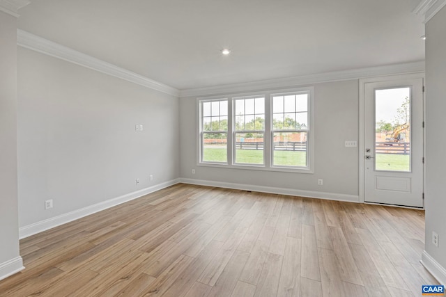unfurnished living room featuring light wood finished floors, baseboards, ornamental molding, and recessed lighting